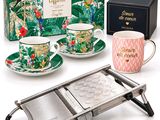an assortment of coffee cups and saucers in front of a box