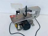 an image of a sewing machine on a white surface