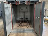 a large open door in the middle of a building