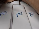 three boxes with chinese writing on them on a shelf