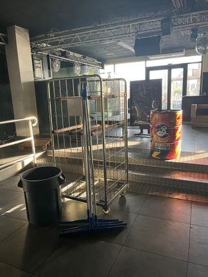 a large metal cage in the middle of a room
