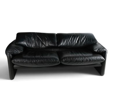an image of a black leather couch against a white background