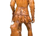 wooden statue of a man with a dog on a wooden base