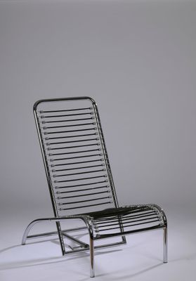 an image of a metal lounge chair against a white background