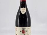 a bottle of wine that is sitting on a table