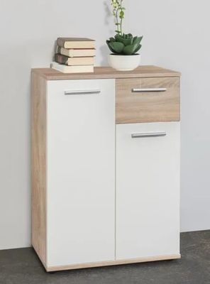 une armoire blanche et en bois sur laquelle est posée une plante
