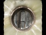a picture of a metal object with a letter h on it