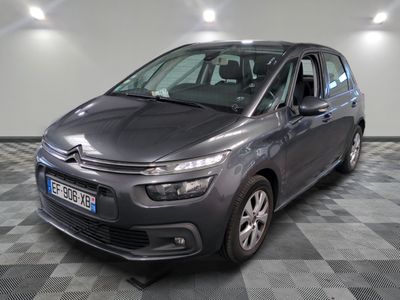 the grey citrole is parked on a checkered tile floor