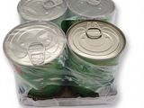six cans of soda sitting in a plastic container