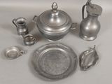 a lot of silver items that are on a table