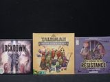 three video games that are sitting on a table