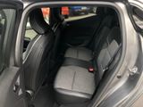 the back seat of a car with the door open in a parking lot