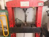 a picture of a red and black machine in a garage
