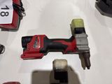 a picture of a cordless drill and other tools on a table