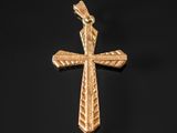 a gold cross on a black background