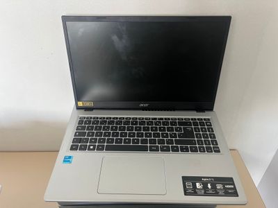 an open laptop computer sitting on top of a wooden desk