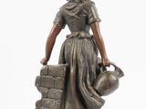 bronze statue of a woman with a jug of water on a pedestal