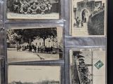 several old black and white photos of people and buildings on a table