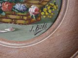 a painting of a basket of flowers on a plate