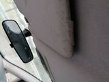 a close up view of a car ' s dashboard with the door handle open