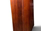 a wooden vase that is sitting on a white surface