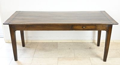 a wooden table with a drawer on top of it