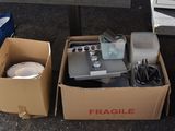 a box with some items in it sitting on the ground