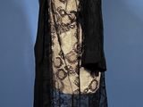 a black and white dress and coat on a mannequin mannequin