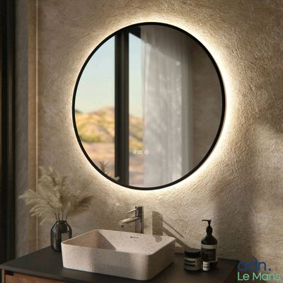 a bathroom with a sink and a mirror in it