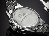 an image of a close up of a watch on a black surface