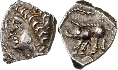 a silver coin with an image of a man on it