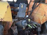 an image of a tractor that is sitting in the dirt