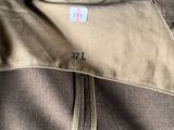 the back of a man ' s jacket with a label on it
