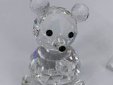 a crystal bear that is sitting on a table