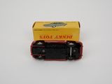 an image of a small toy car in a box on a white surface