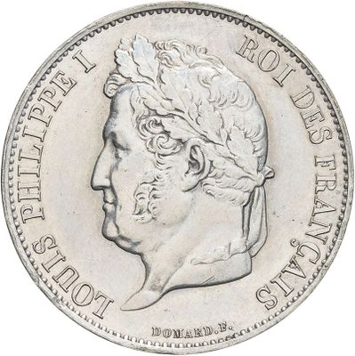an image of a silver coin with a man ' s face on it