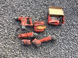 a group of tools sitting on top of a pile of gravel