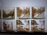 many old photos of people in the woods on the wall