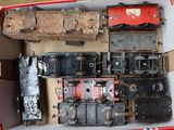 a box with a bunch of old train parts in it