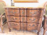 a wooden dresser with ornate carvings on it