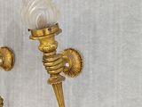 pair of antique brass wall sconces with frosted glass shades