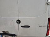 a white van parked on the side of the road