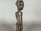 an image of a statue of a person with a hat on