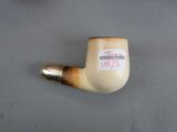 a pipe with a sticker on it sitting on a table