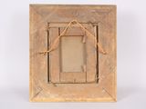 an old picture frame with a rope hanging from it ' s side