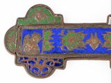 a blue and green broochee with a bird on it