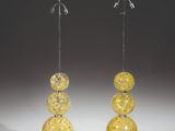 pair of yellow glass lamps on metal bases