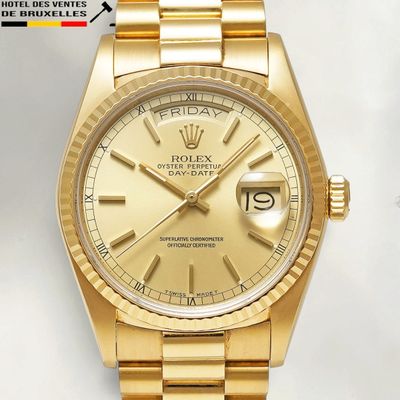 an image of a gold rolex watch on a white background