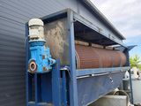 a blue machine that is sitting on the side of a building