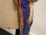 a mannequin with a blue and red scarf on it